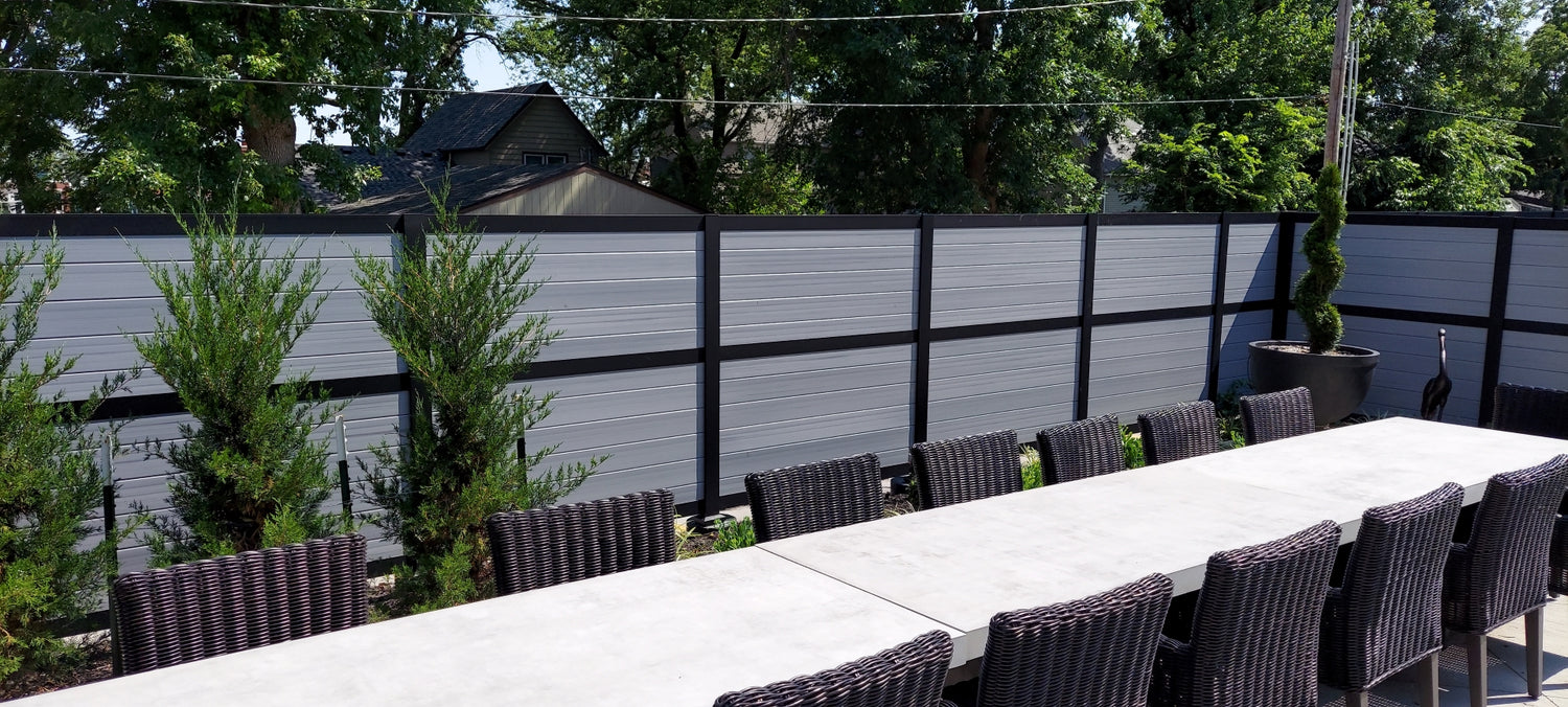 Hidaway privacy fence sheltering large outdoor table from the wind and peering eyes