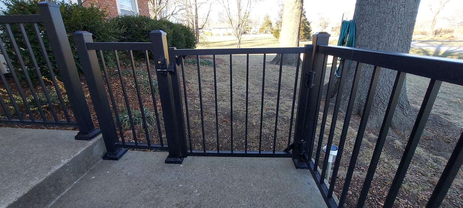 Azek Impression Express aluminum railing on front porch walkway with gate leading to the yard, posts anchored to concrete and built to last all aluminum imp ex rail impression rail express