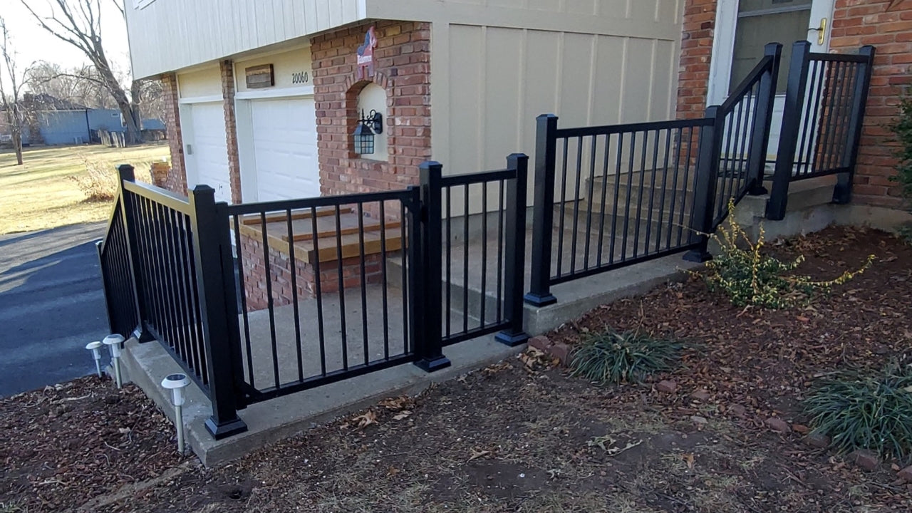Front sidewalk with strong aluminum handrail barrier that contours the walkway and makes it easy to walk