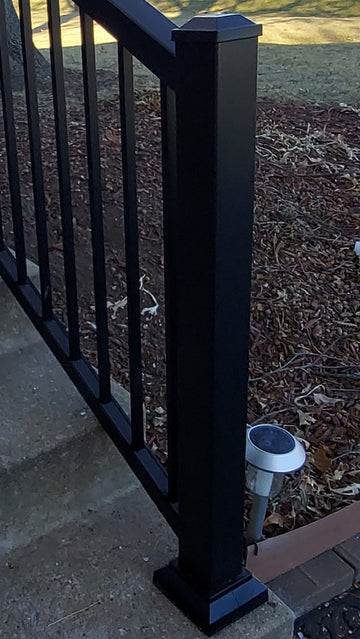 Black Texture Tall Residential Stair Post on concrete at the bottom of the stairs in aluminum by impression express