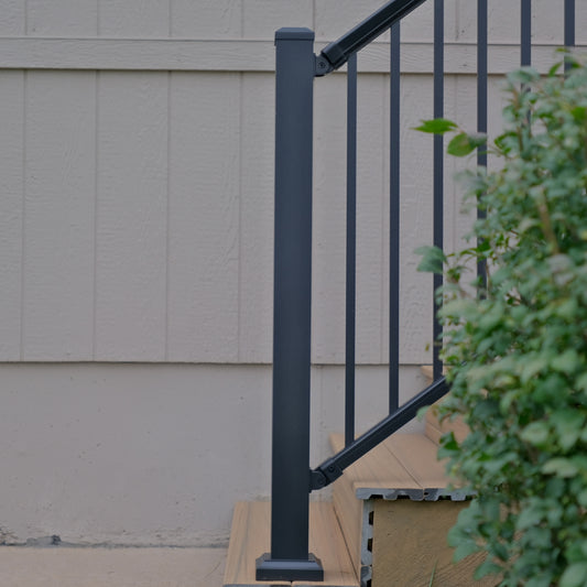 Dekpro Prestige 44" Aluminum Post installed at the bottom of a composite deck staircase.