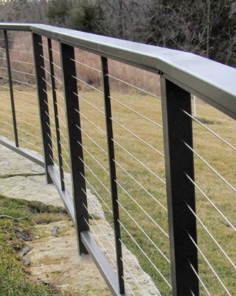 DesignRail aluminum and stainless steel horizontal cable with series 200 on curved bluff with posts core drilled into stone Deck & Rail Supply has been selling designrail like this for years! This railing was installed in 2014 in Overland Park, Kansas