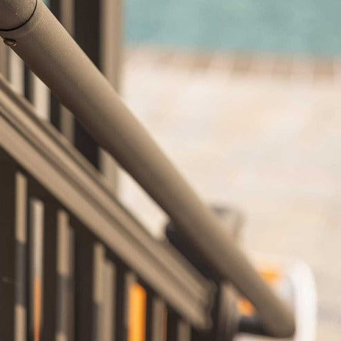 Close up photo of round graspable ada compliant rail by keylink