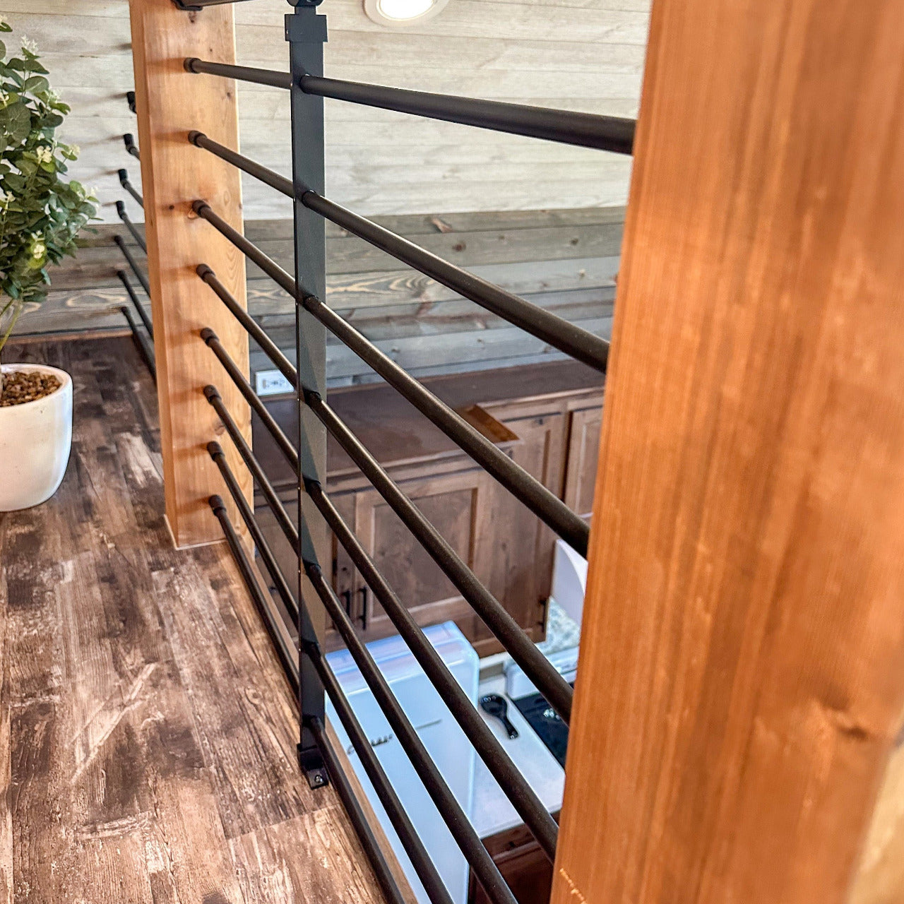 Wooden posts with aluminum rod rail kit infill from dekpro includes 8 rods for 36 inch railing, rod brackets for level, and mid-post with footblocks