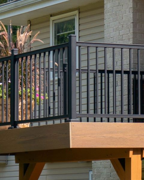 Aluminum deck railing on a walkout composite deck finishes the space nicely. Here we see advantage rail in textured black
