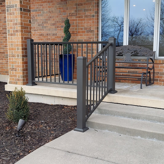 Aluminum front porch railing on steps of concrete stairs or steps
