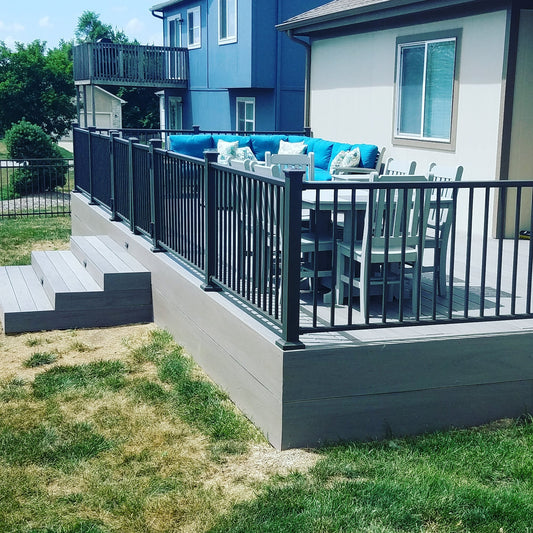 Cocoa Bronze DekPro Railing with TimberTech Ashwood Lighted Effex, Deck is skirted to the ground with fascia and has extra deep steps