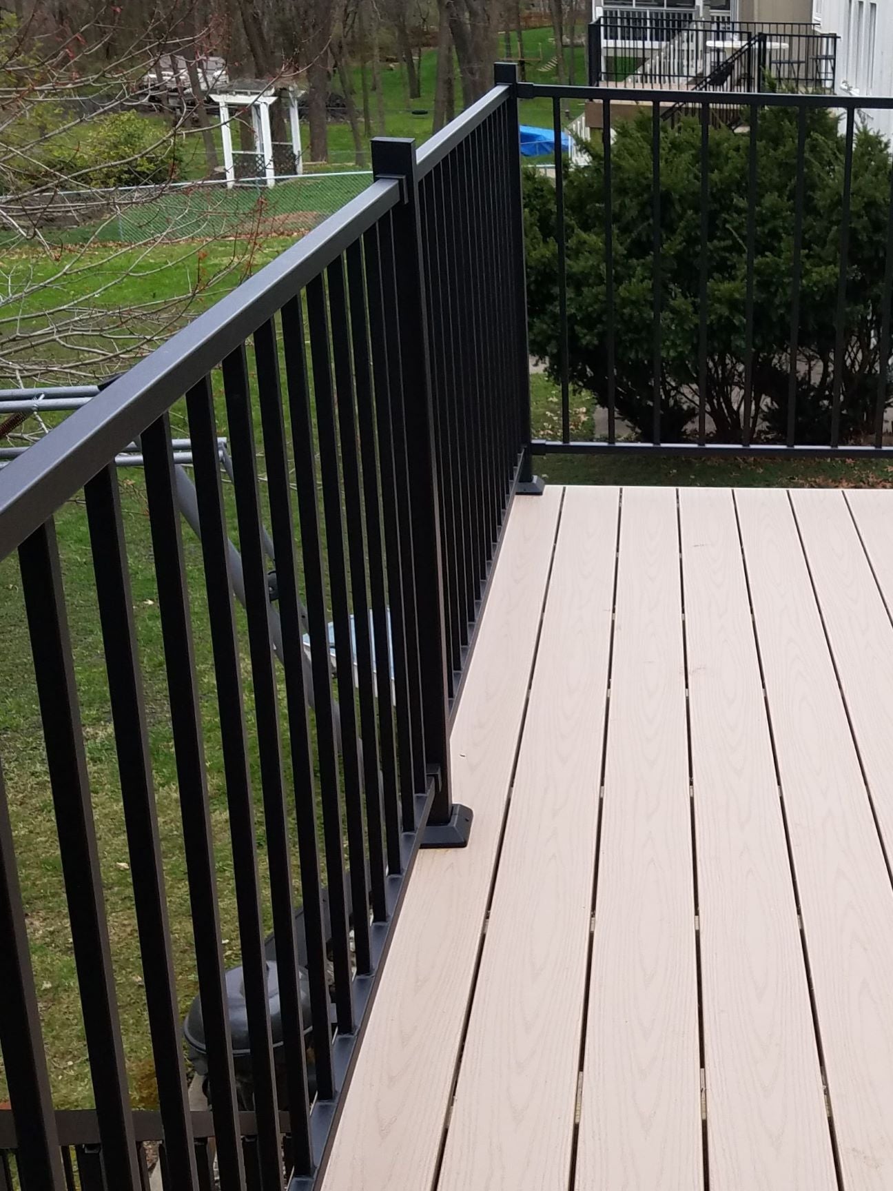 Iron railing type rail solid welded iron powder coated and heavy. Is a great priced railing option but needs to be maintained with paint to preserve logevity