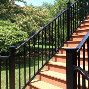 DekPro Prestige Railing W/Accents Caps 3" post down stair path to a landing, stair railing from dekpro prestige is sturdy and stable and needed when walking up and and down a large set of staris