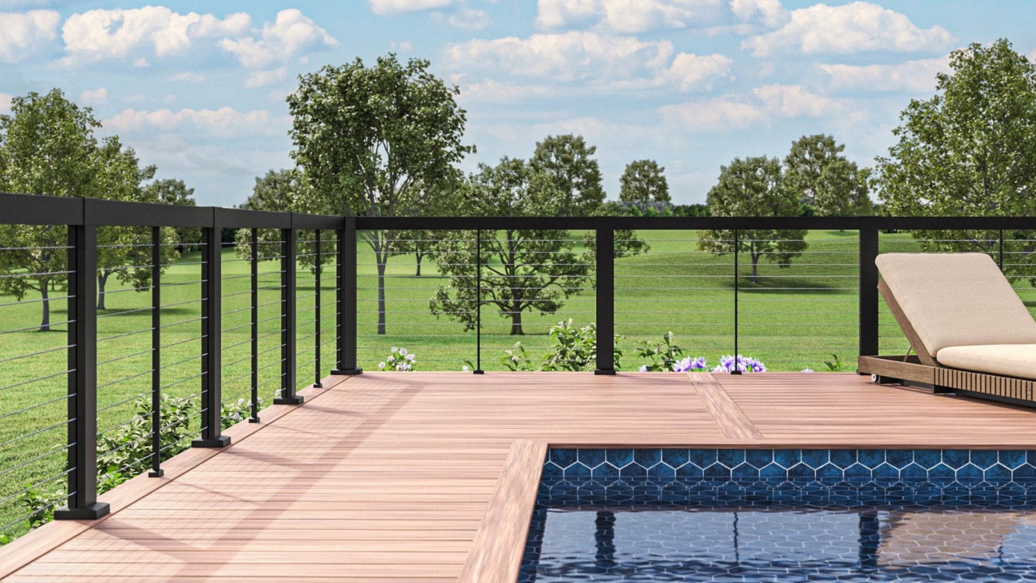 RDI Elevation horizontal cable railing system black posts rails and pickets with seethrough cable on a pool deck under blue cloudy skys and green landscape Barrette