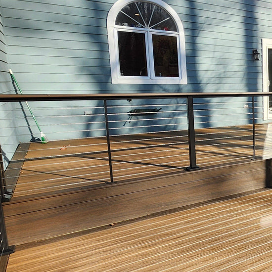 Feeney Modern Drink Rail shown with cap rail, Posts, and Cables sold separately. 
