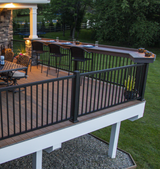 A unique deck with KeyLink aluminum rail in both American and Chesapeake, featuring a table-top-rail.