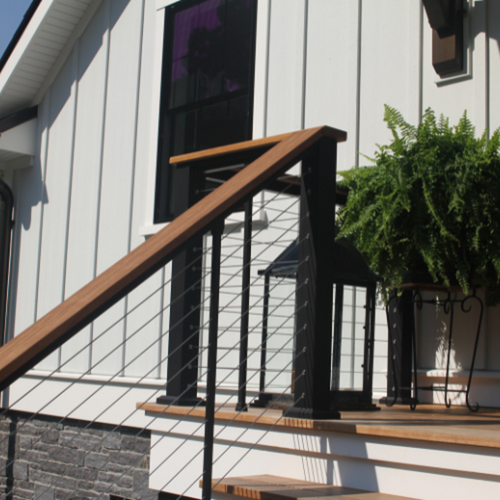 KeyLink Chesapeake horizontal cable railing with a deck board as a top cap for a beautiful and grand railing.