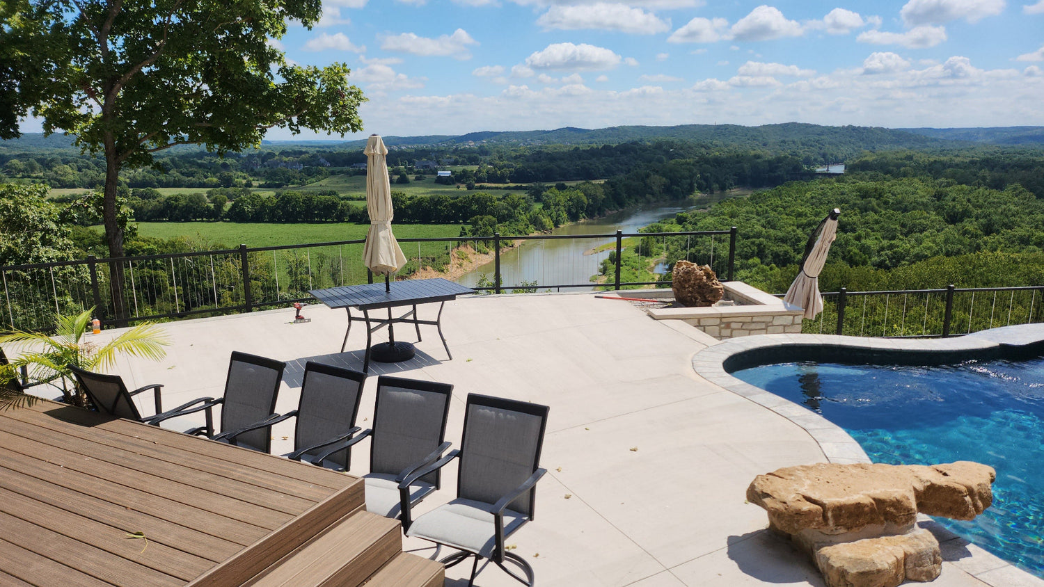 KeyLink Vertical Cable Railing infront of a beautiful river green valley