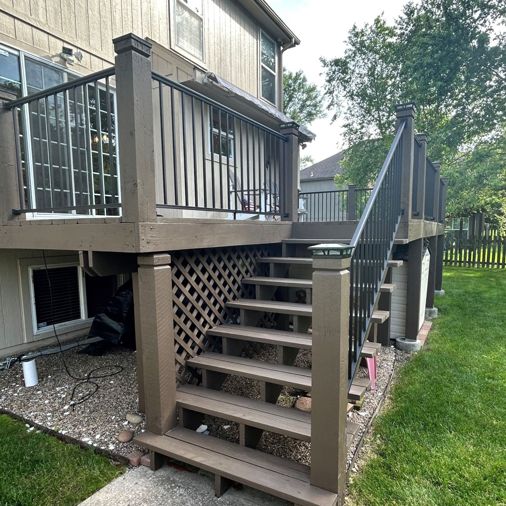 Outlook railing by keylink on stairs and back deck corner installed to existing wood six by six posts