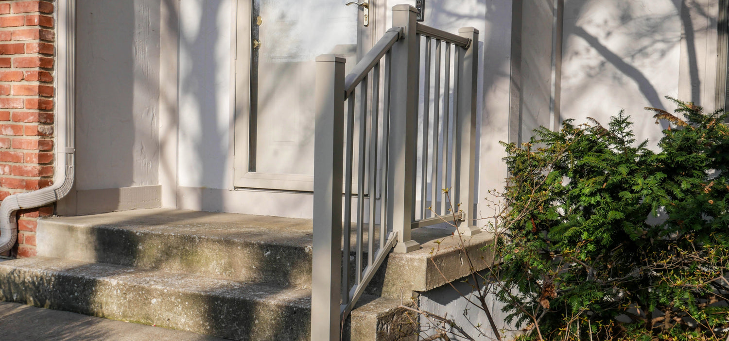 Dekpro Prestige Maple Cream handrail on concrete front of house stairs, matching the accent color of the house.