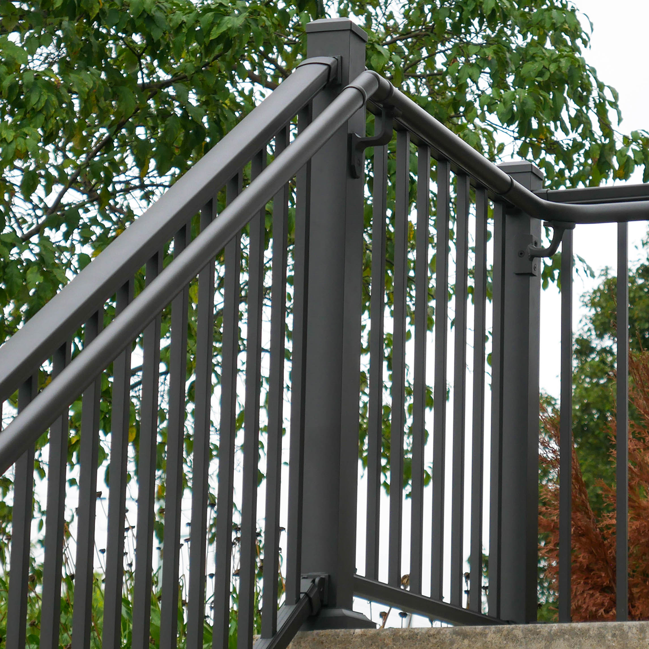 Dekpro Prestige Cocoa Bronze Stair Post attached to secondary handrail.