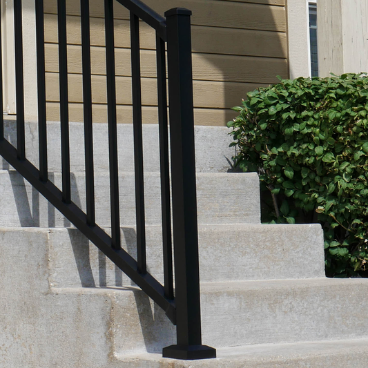 47" aluminum Westbury Textured black stair post on concrete stairs.