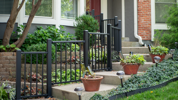 Westbury Step Front Stair Rail with stepping railing all level on a curved stair case in concrete