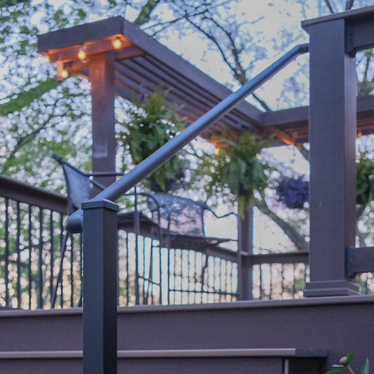 Deck Stairs showing a round single handrail known as a continuous handrail between rail posts