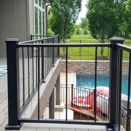 Top Deck in Black Texture C80 VertiCable a stainless wire railing system by westbury has 4x4 posts w/ lighted caps and 2" crossover posts