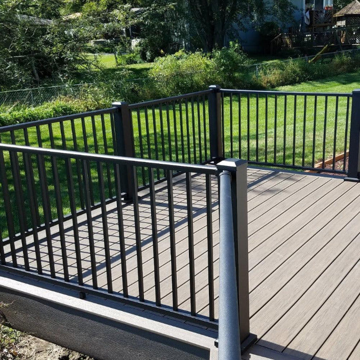 Tuscany Level Railing on side deck with angled level rail using level angle brackets post with cap and flair all level aluminum black railing