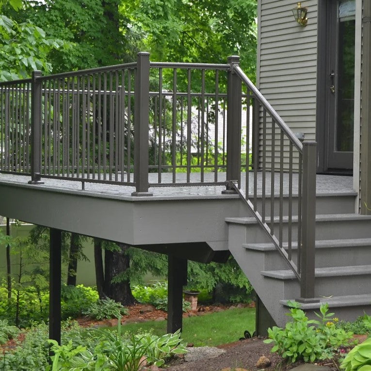 Outlook aluminum railing on back gray deck with steps and handrail around the perimeter and outlook rail on stairs