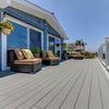 back deck on a warm day with gray stone ash terrain decking by timbertech