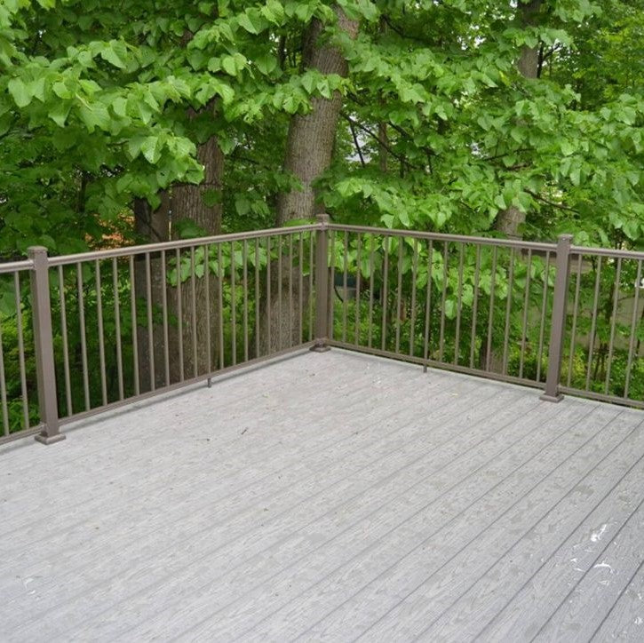 Bronze Outlook KeyLink Aluminum Deck Post Railing around foleyage and greenery